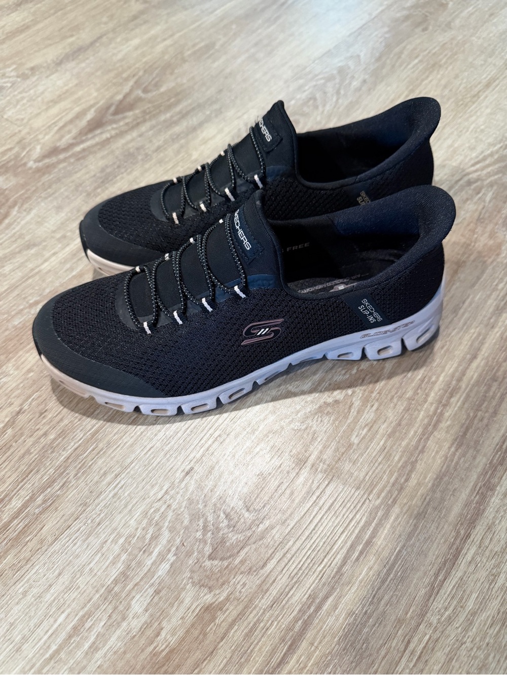 Skechers Women’s  Black Knit Slip-On Athletic Sneakers with White Sole